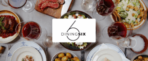 DiningSix-logo foran et dækket bord med mad og vin set oppefra