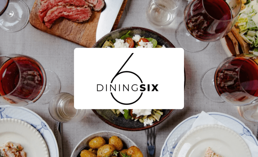 DiningSix-logo foran et dækket bord med mad og vin set oppefra